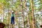 Girl on hinged trail in extreme rope Park