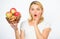 Girl hold basket apples white background. Metabolism and dieting. Healthy nutrition concept. Woman know how stay in