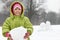 Girl hold of in hands lump of snow