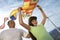 Girl Holding Airplane Kite With Father