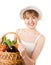 Girl holding a basket of delicious fresh vegetable