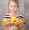 Girl holding a basket of fruit