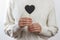 Girl holding Black heart board on white background , Valentines Day