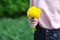 Girl holding a blossoming dandelion in hands