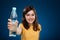 Girl holding bottle of water