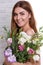 Girl holding a bouquet of Japanese roses close-up