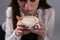 Girl holding a cup of cappuccino. Pattern on coffee. Girl& x27;s hands holding a cup of coffee.