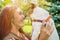 Girl is holding dog Jack Russell Terrier and kissing