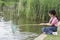 Girl Holding Fishing Net At River