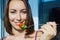 A girl holding a fork with vegetables