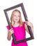 Girl holding frame around face