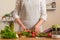 Girl holding fresh vegetables. The concept of losing healthy and wholesome food, detox, vegan eating, diet, cooking. Slow food,