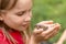 Girl holding frog