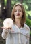 Girl holding a giant dandelion