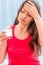 Girl holding glass of dissolving drug