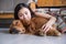 Girl holding the Golden Retriever to sleep