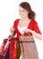 Girl holding group shopping bag.
