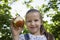 Girl Holding Half Eaten Apple Outdoors