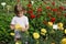 Girl holding in her hand yellow flower