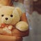 A girl is holding and hugging a teddy bear. Concept idea - goodbye to childhood. Vintage style. Place for your text