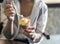 Girl holding ice cream, hands holding ice cream, eating ice cream.