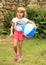 Girl holding inflating ball