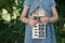 Girl holding insect hotel