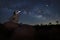 Girl Holding Lantern in the Desert Under the Milky Way