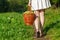 Girl holding large baskets of apples