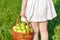 Girl holding large baskets of apples