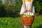 Girl holding large baskets of apples