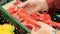 Girl is holding a large, red chili pepper