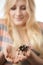 Girl holding a large spider on her hands