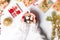 Girl holding marshmallow dessert in a cup with festive decoratio