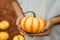 Girl holding medium sized bumpy pumpkin