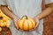 Girl holding medium sized bumpy pumpkin