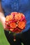 Girl holding an orange bouquet