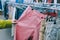 Girl holding pants in the hands in the supermarket