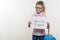 Girl holding piece of paper with a word WEATHER EXPERT. White bakgrounde, copy space