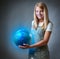 Girl holding the Planet Earth