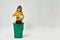 Girl holding plastic bottles over full dustbin