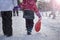 The girl is holding a red sled in her hands to ride the hill. Sledging. Activities for children and teenagers. Winter