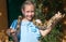 Girl holding snake.