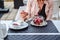 Girl holding a spoon with fruit vanilla cake