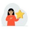 The girl is holding a star. Service rating or positive user rating. Consumer review of the product. Feedback.