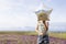 Girl Holding Star Shaped Balloon In Front Of Face At Flower Field