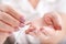 Girl holding tampon during the monthly cycle. Young woman hands