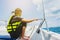 Girl holding tight the rope when riding on speed boat