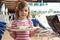 Girl holding tray with food on cruise liner