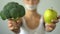 Girl holding vegetables, low-carb diet, vegetarian recommending organic food